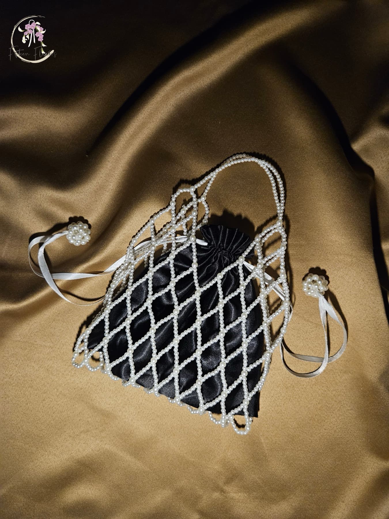 Pearl net bag with dark satin lining